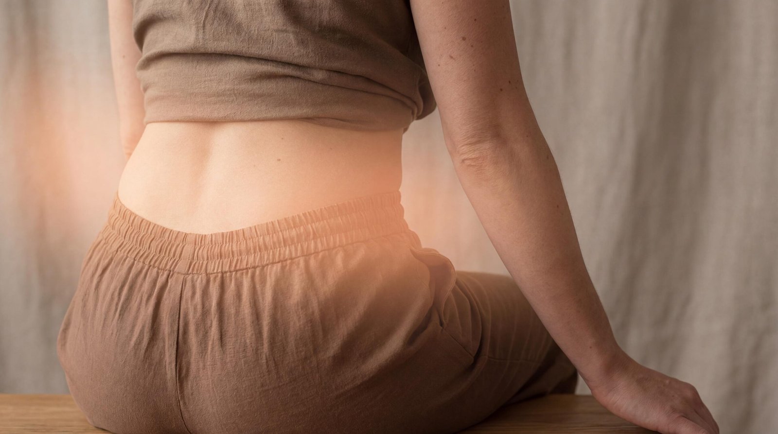 Photorealistic image highlighting the lower back and flank area where kidney stone discomfort is commonly felt